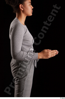 Zahara  1 arm dressed flexing grey sweatshirt side view…